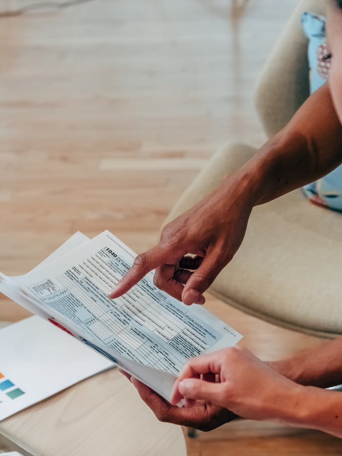 Person Holding a White Paper